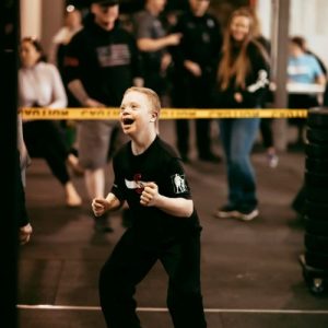 Boy with down syndrome doing crossfit
